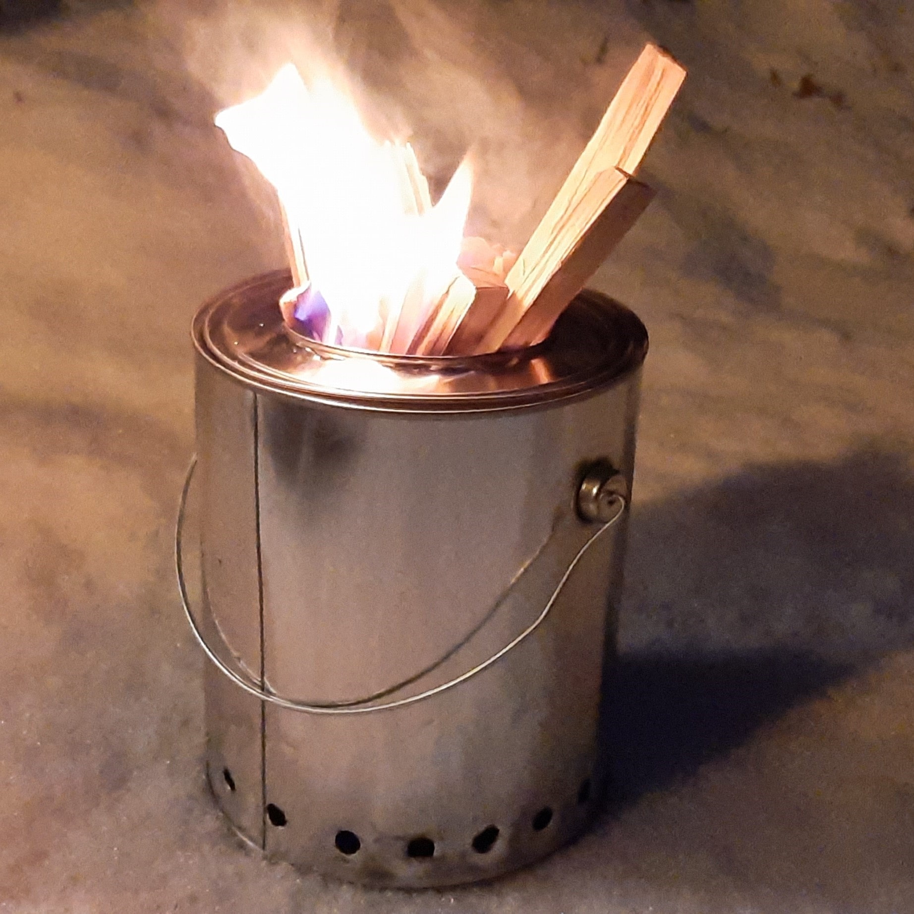 Fire lit in the December snow